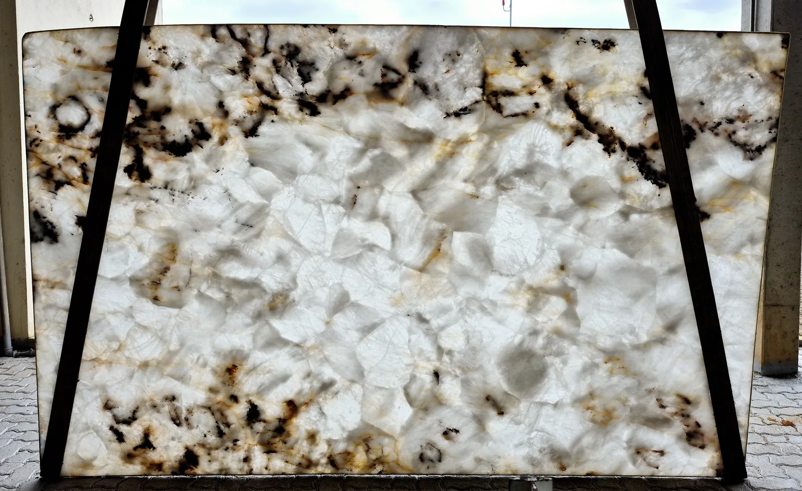 Cristallo quartzite slab backlit, showing translucent crystalline body